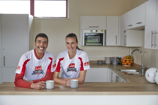 Howdens Game Changer Programme ambassadors Chris Kamara MBE and Jill Scott MBE in a grassroots football club kitchen
